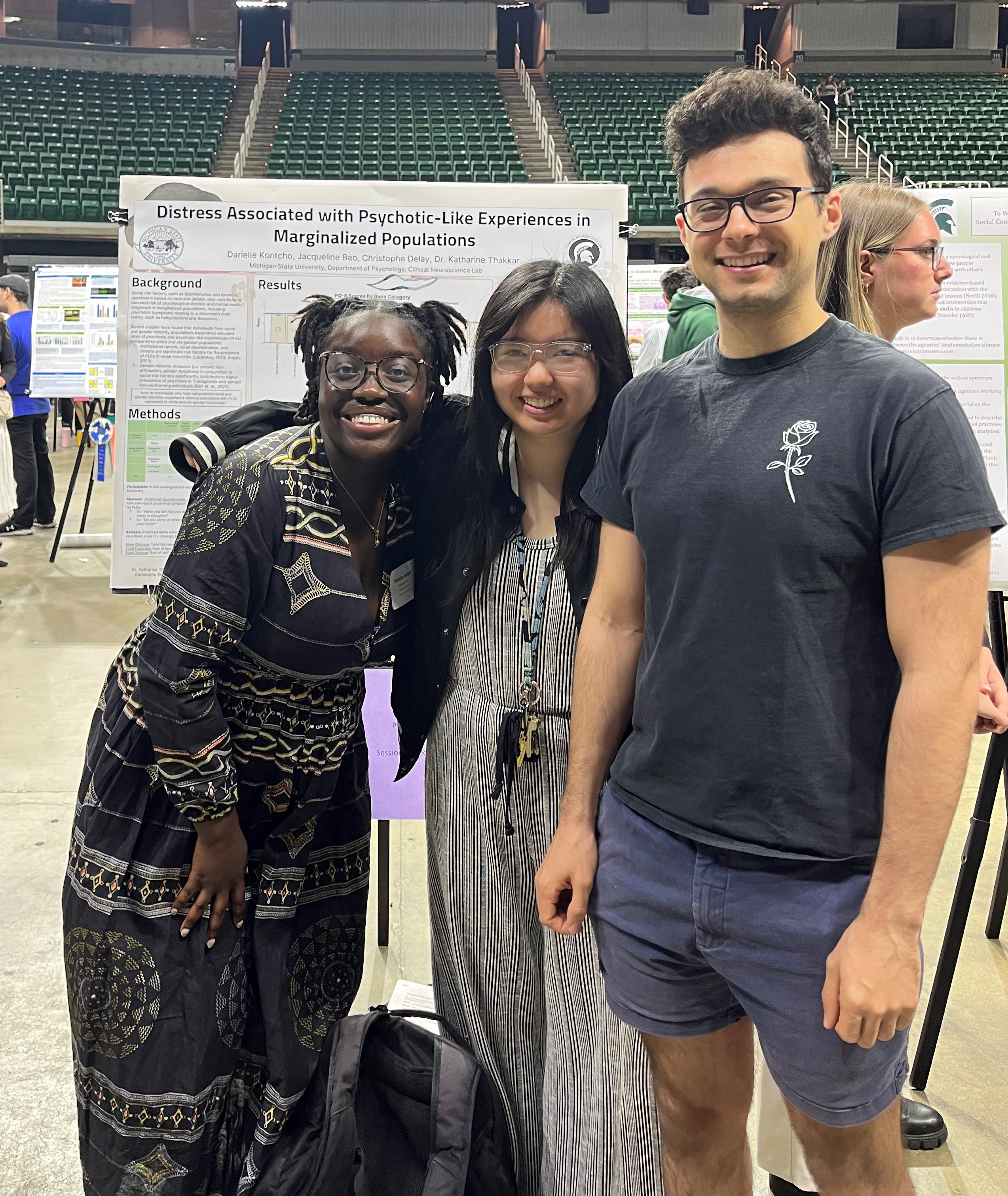 Members of the Clinical Neuroscience Lab stand with Darielle Kontcho and her poster at UURAF