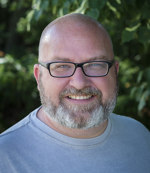 Close up of Dr. Nathan Carter smiling at camera.