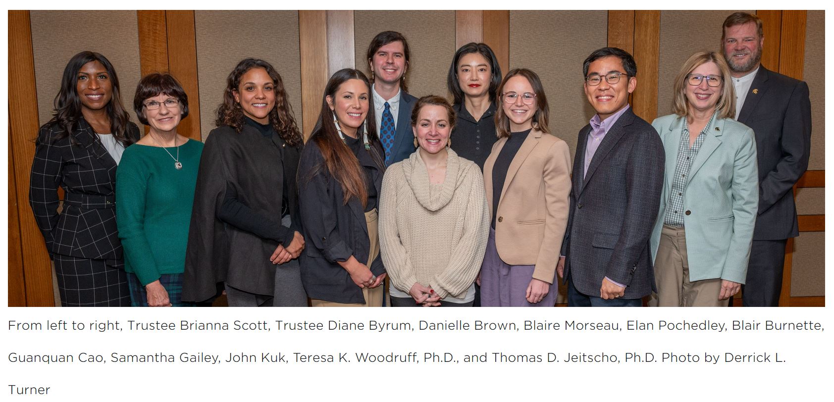 The first cohort of 1855 Professorship stand with Trustee Brianna Scott, Trustee Diane Byrum, Teresa K. Woodruff, PhD, and Thomas D. Jeitscho, Phd.
