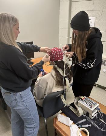 Bre Lind works with a coworker in the lab. 