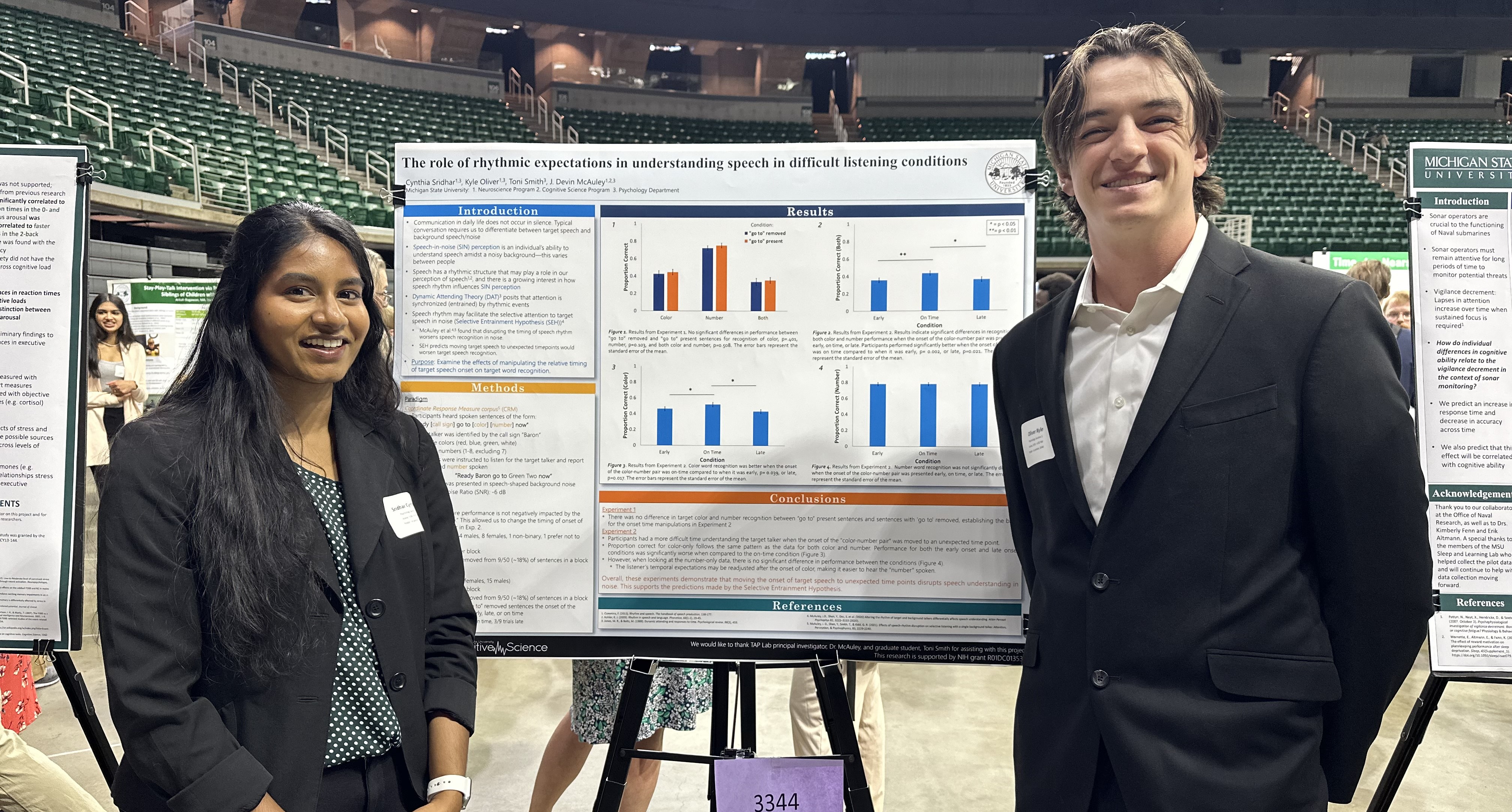 Kyle Oliver and his research partner stand in front of their poster at the University Undergraduate Research and Arts Forum (UURAF) in 2022.