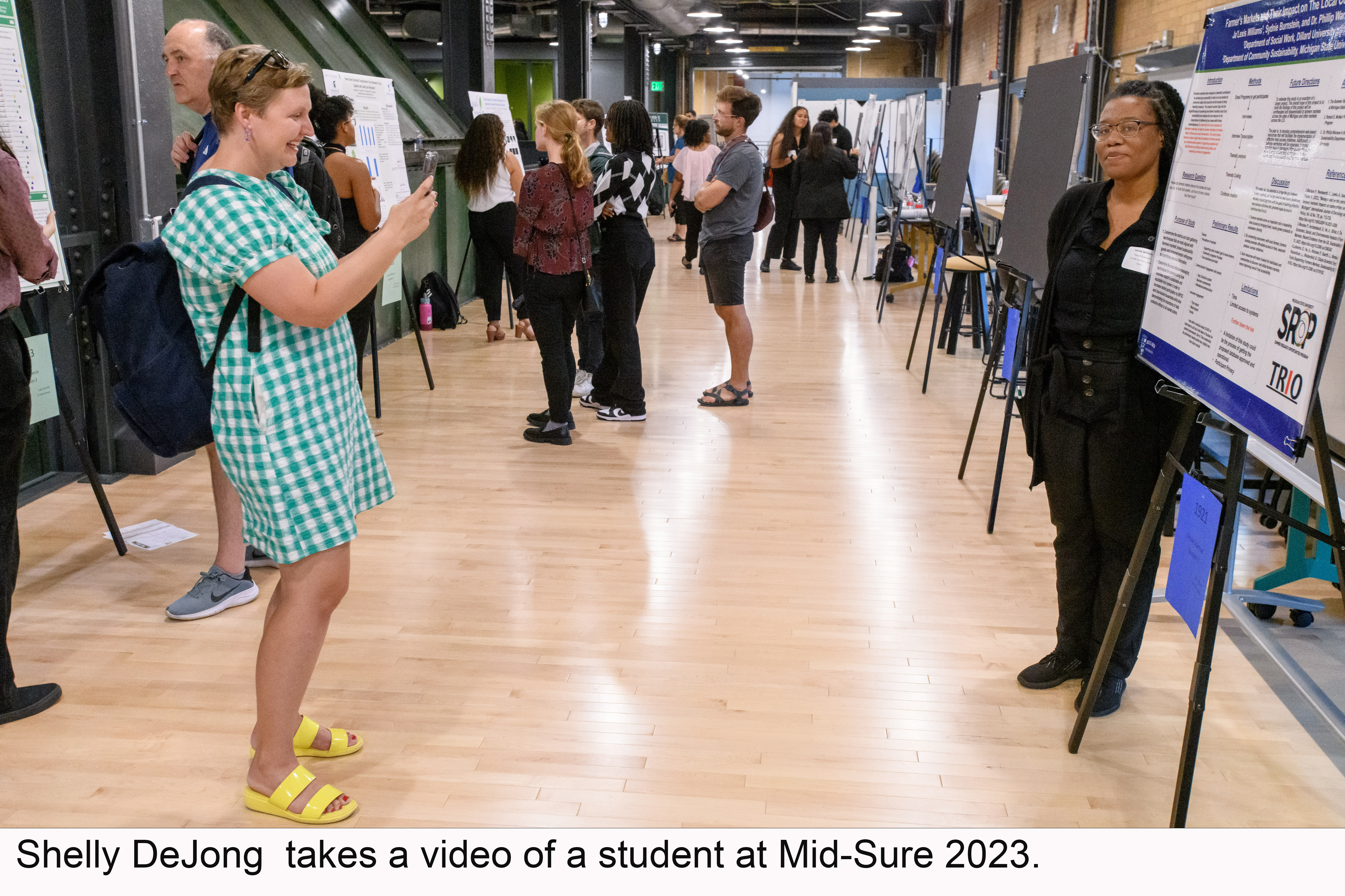 Shelly DeJong taking a video of a student at Mid-Sure 2023.