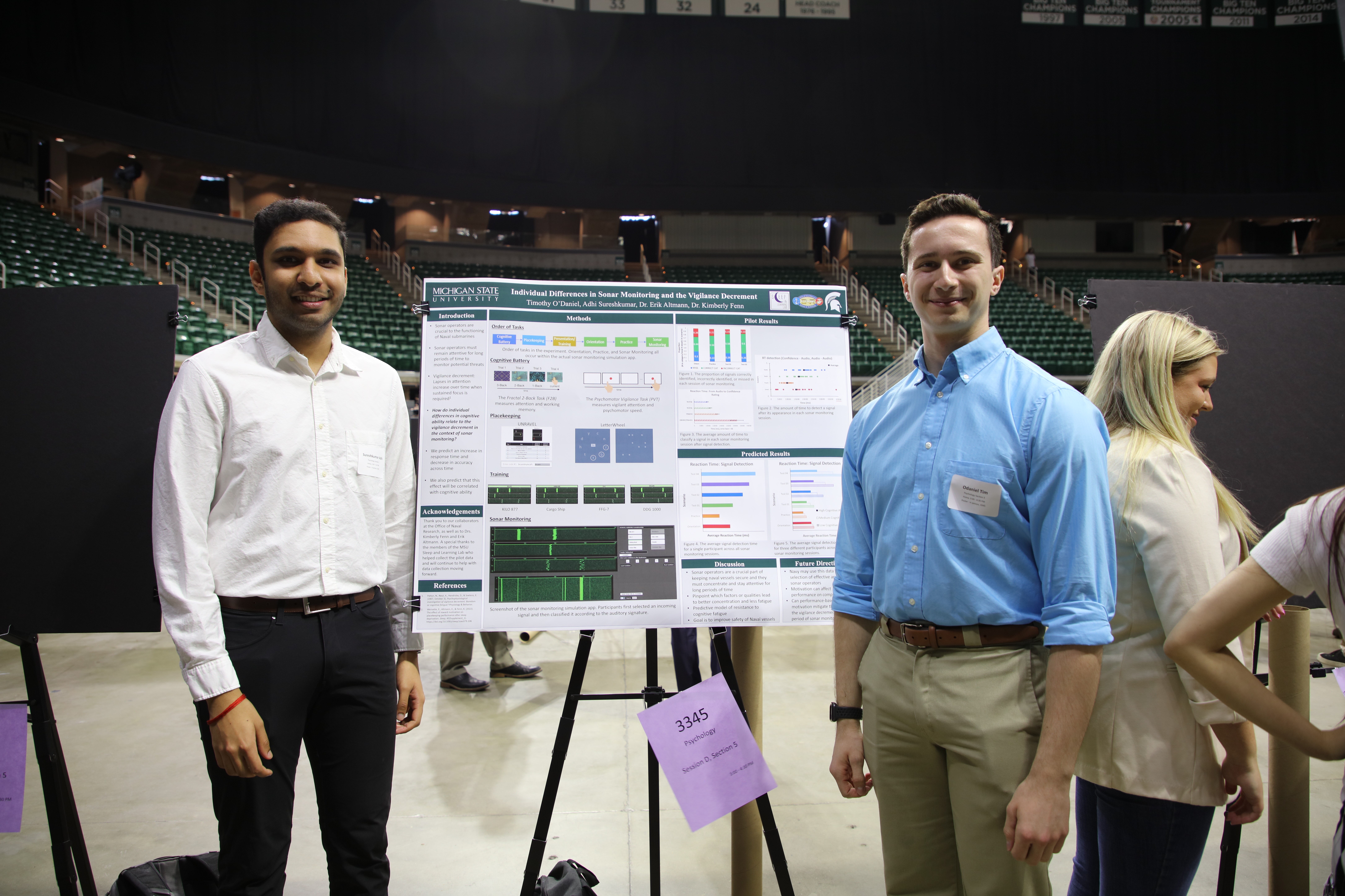 Tim and Adhi with their poster at UURAF