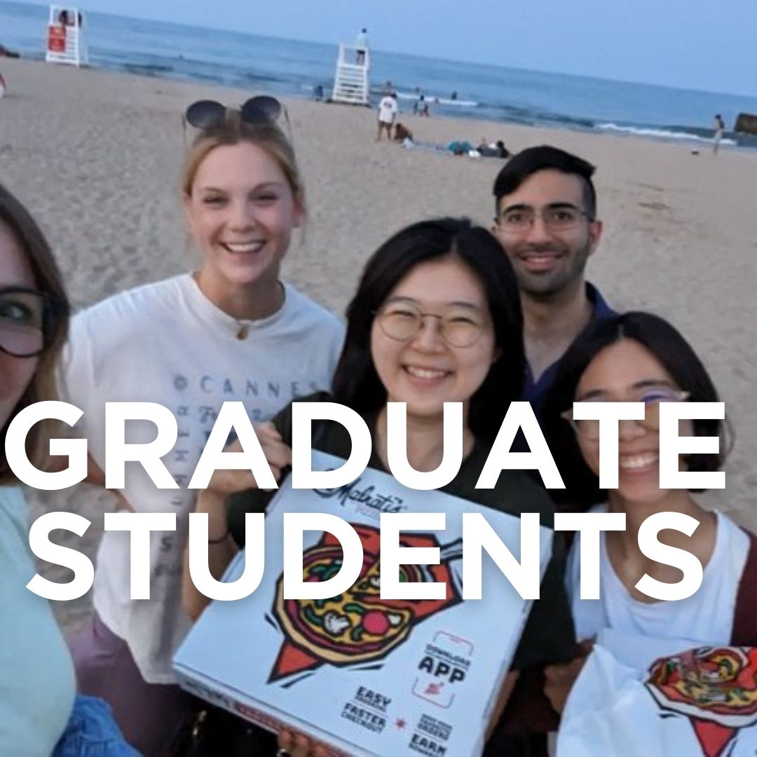 GRADUATE STUDENTS written over the top of a photo of graduate students and an alum at the beach holding a pizza.